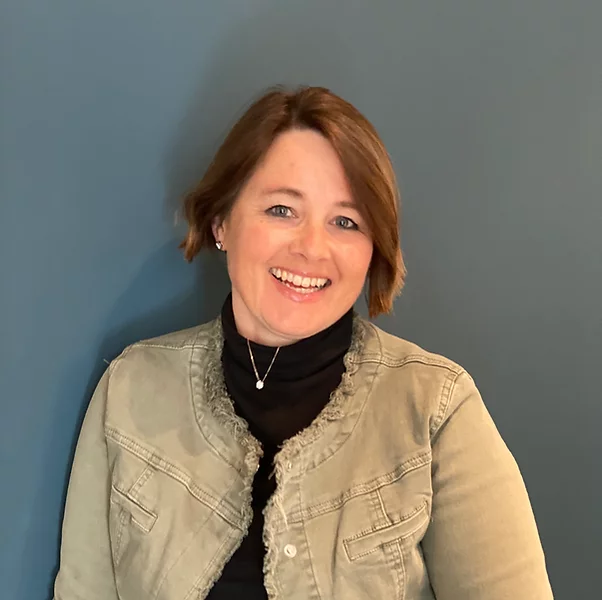 a woman wearing a black shirt and a black neck tie.